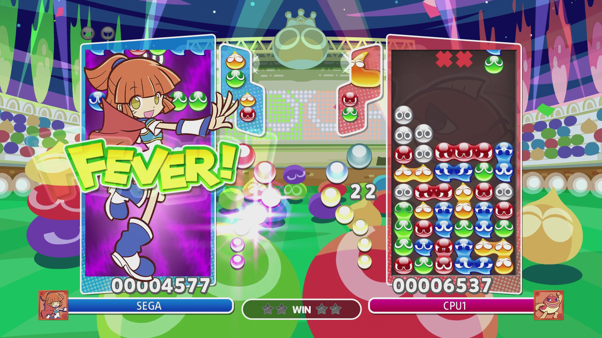 Partida de Puyo Puyo Champions com campos competitivos lado a lado